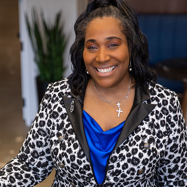 Close-up portrait of woman dressed in business casual clothing.