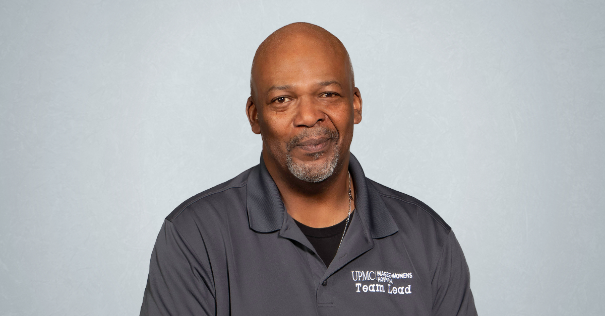African American man named Tom smiles at camera.