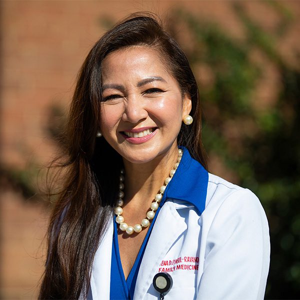 Physician in white coat.
